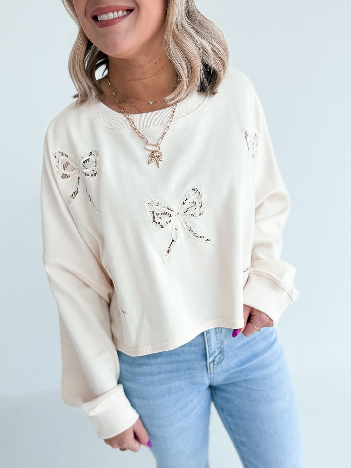 Luck in Lace Bow Crop Sweatshirt