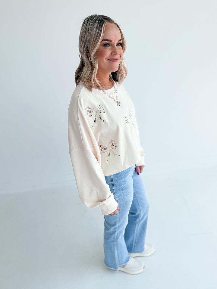 Luck in Lace Bow Crop Sweatshirt