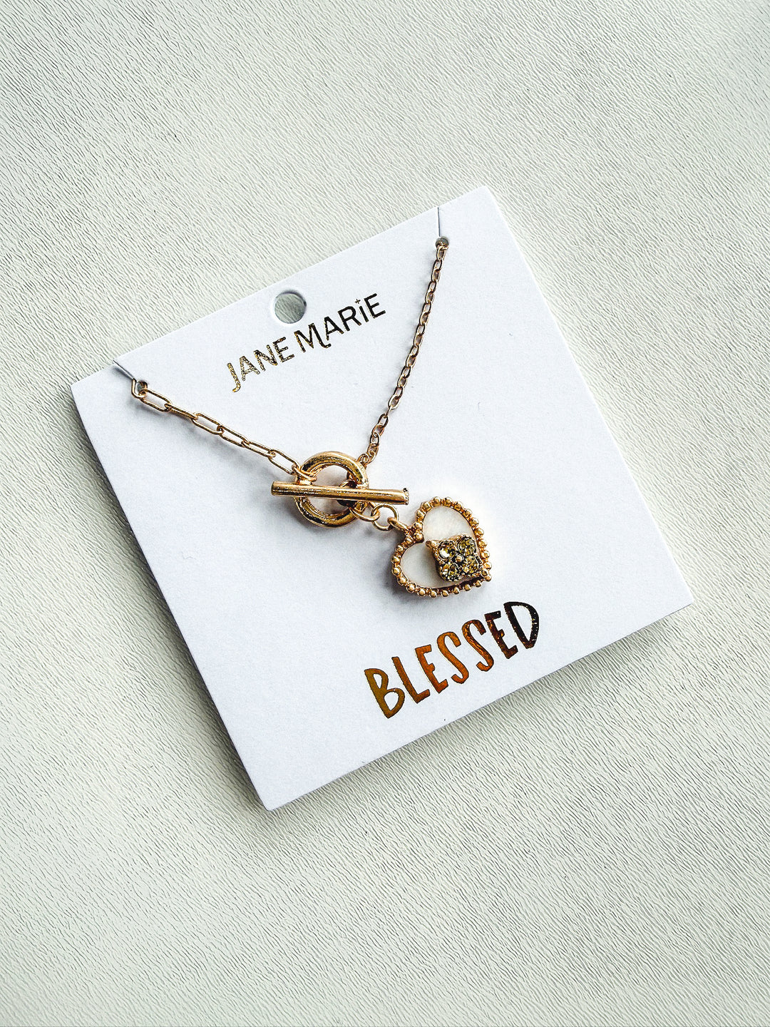 Gold Paperclip Chain with Shell Heart